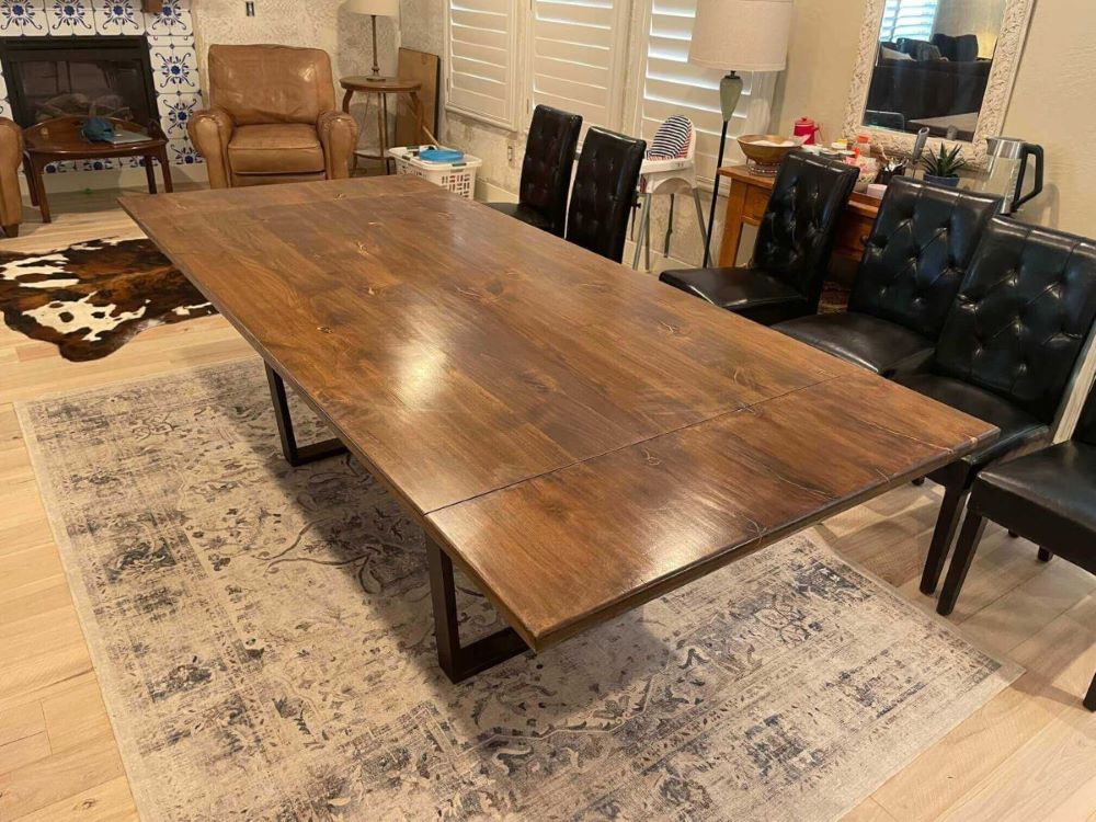 A shining drawing room table in a house with beautiful sofe and chairs - kitchen and dining table build by Fox in the Sawdust